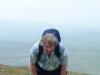 Alex pauses for breath at the top of High Pike...